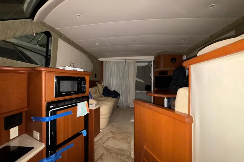  Yacht Photos Pics Interior of 2005 Silverton 34 Convertible yacht with kitchen and seating area.