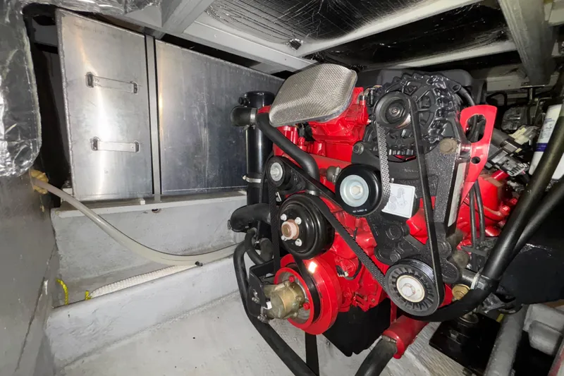  Yacht Photos Pics Engine compartment of a 2005 Silverton 34 Convertible boat, featuring a red engine.