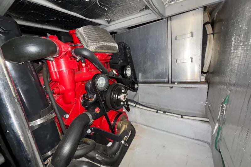  Yacht Photos Pics Engine room of 2005 Silverton 34 Convertible with red engine components.