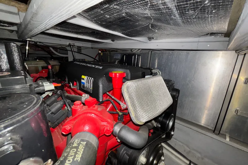  Yacht Photos Pics Engine compartment of a 2005 Silverton 34 Convertible boat, featuring a Volvo Penta engine.