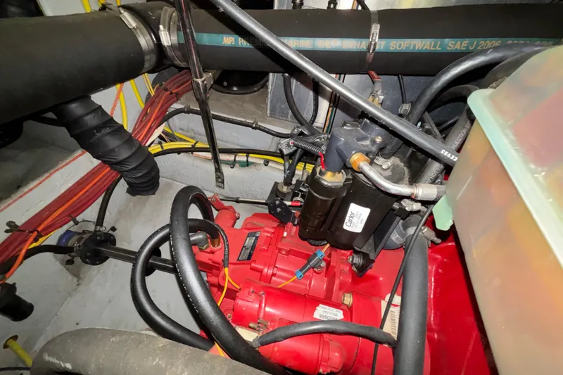  Yacht Photos Pics Engine compartment of a 2005 Silverton 34 Convertible boat, showing mechanical components and wiring.