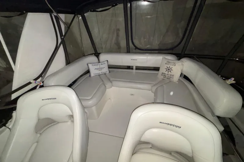  Yacht Photos Pics 2005 Silverton 34 Convertible boat interior with white seating and decorative pillows.