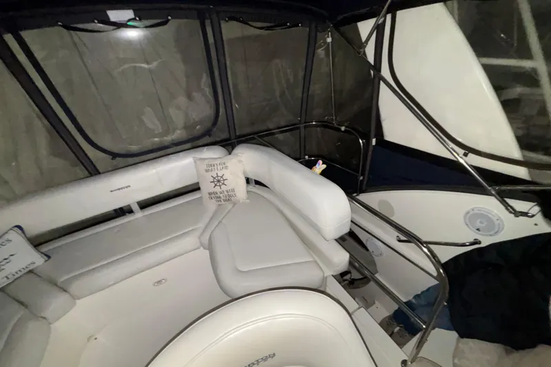  Yacht Photos Pics Interior of 2005 Silverton 34 Convertible boat with white seating and nautical decor.