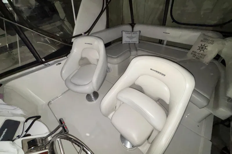  Yacht Photos Pics 2005 Silverton 34 Convertible boat interior with white seating and helm.