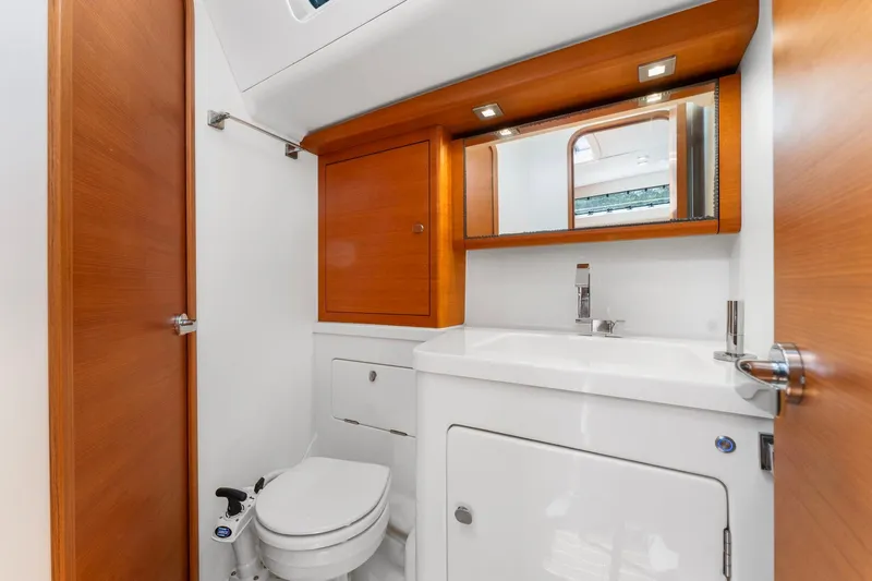 Rusalka Yacht Photos Pics Luxurious bathroom in 2015 Italia Yachts 13.98, featuring modern fixtures and wooden accents.