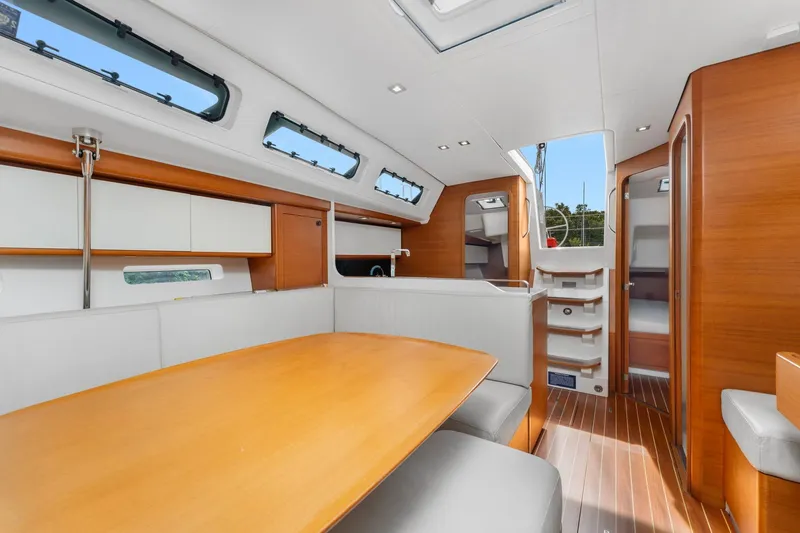 Rusalka Yacht Photos Pics Luxurious interior of 2015 Italia Yachts 13.98, featuring elegant wood finishes and modern design.