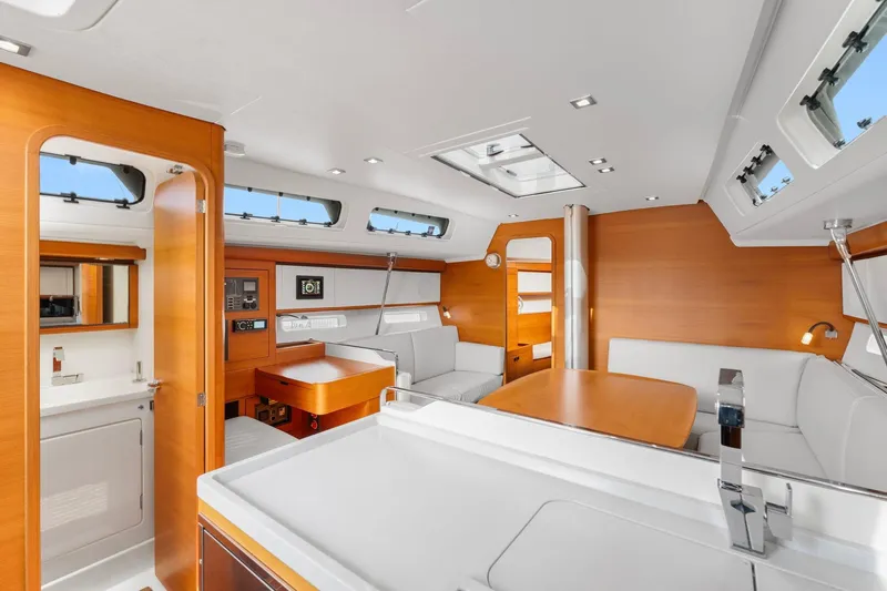 Rusalka Yacht Photos Pics Luxurious interior of 2015 Italia Yachts 13.98, featuring modern design and elegant wood finishes.