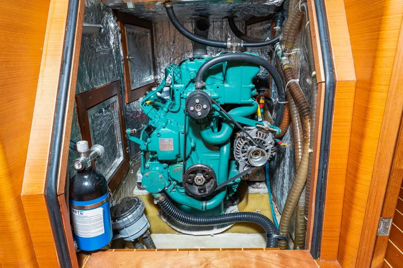 Rusalka Yacht Photos Pics Engine compartment of 2015 Italia Yachts 13.98, featuring a green marine engine.