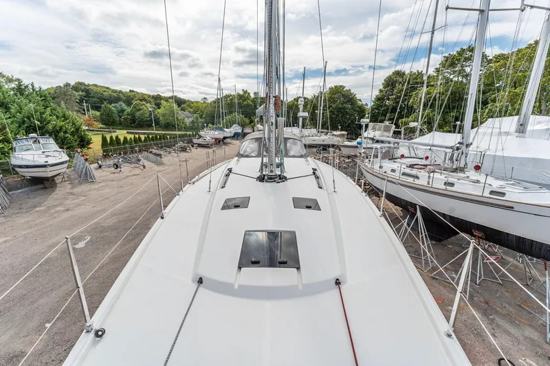 Rusalka Yacht Photos Pics Italia Yachts 13.98 (2015) sailboat on land, surrounded by other boats and greenery.