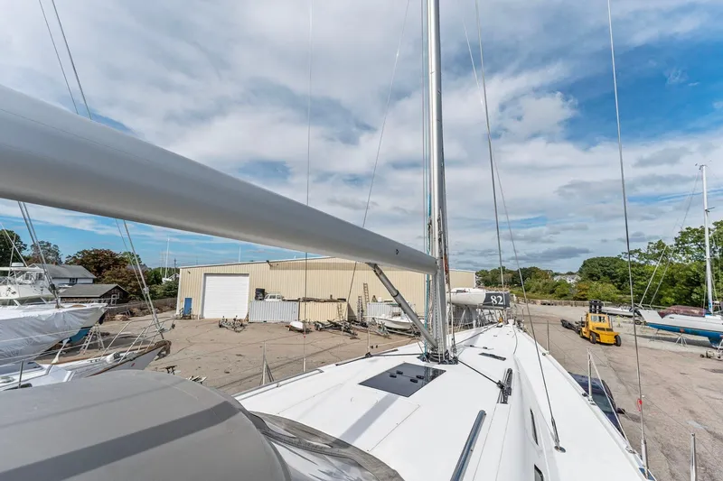 Rusalka Yacht Photos Pics Italia Yachts 13.98 sailboat, 2015 model, docked in a shipyard under a partly cloudy sky.