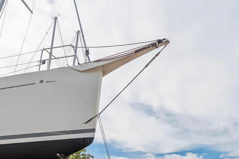 Rusalka Yacht Photos Pics Italia Yachts 13.98 (2015) sailboat bow against a cloudy sky.
