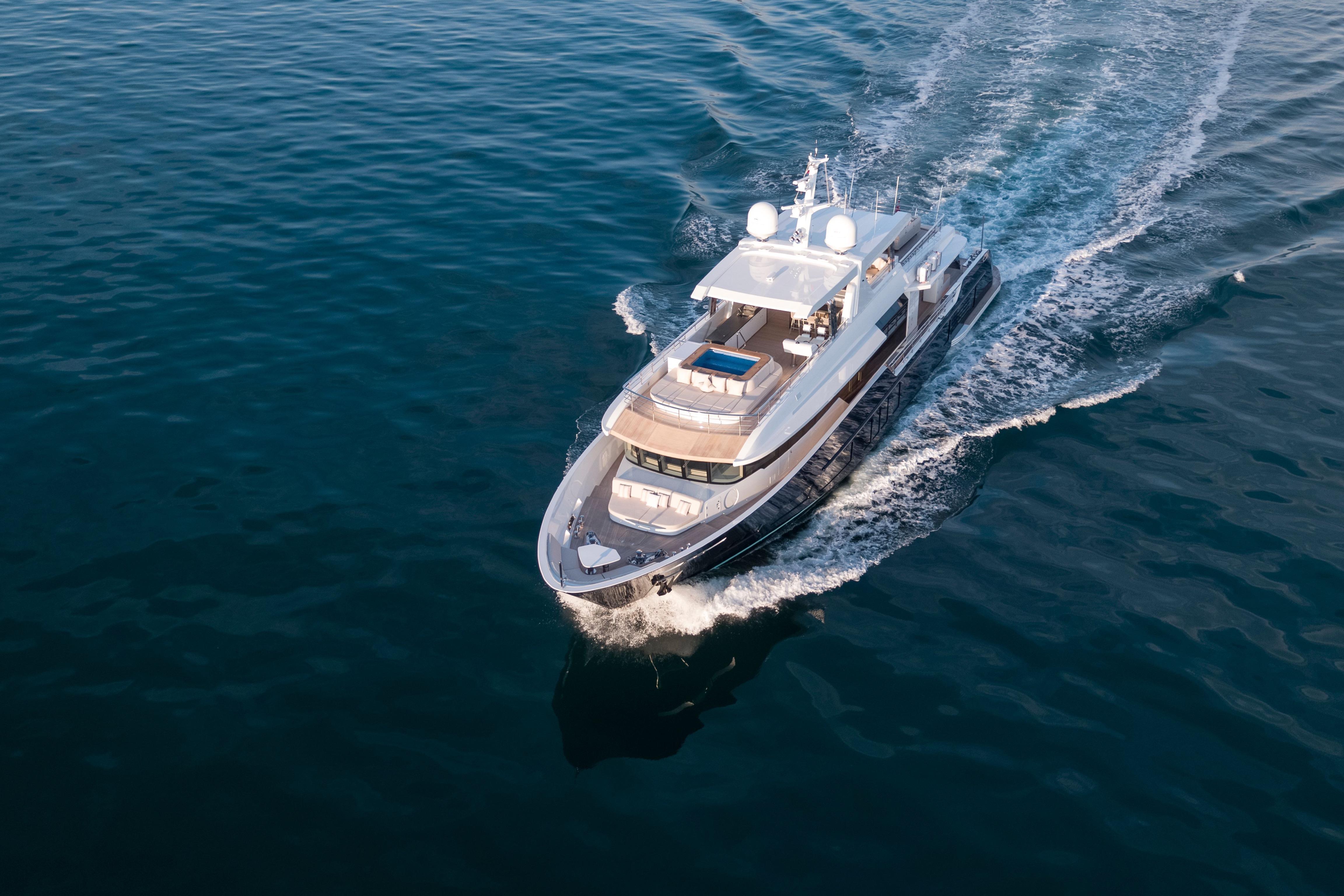 Luxurious 2020 Alpha Alfresco 125 yacht cruising on open water.