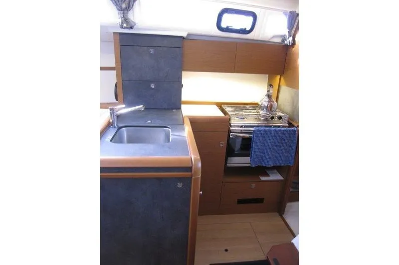 Naia Grey Yacht Photos Pics Interior view of 2022 Jeanneau Sun Odyssey 349 yacht kitchen area.