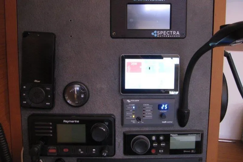 Naia Grey Yacht Photos Pics Control panel of 2022 Jeanneau Sun Odyssey 349 yacht with navigation and communication equipment.