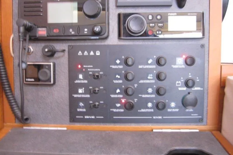 Naia Grey Yacht Photos Pics Control panel of a 2022 Jeanneau Sun Odyssey 349 sailboat, featuring navigation and communication equipment.