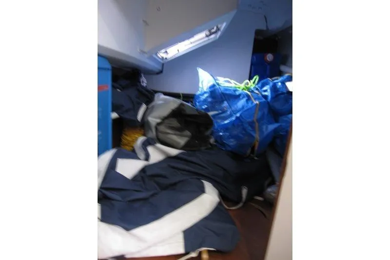 Naia Grey Yacht Photos Pics Interior of 2022 Jeanneau Sun Odyssey 349 with stored sailing gear and equipment.