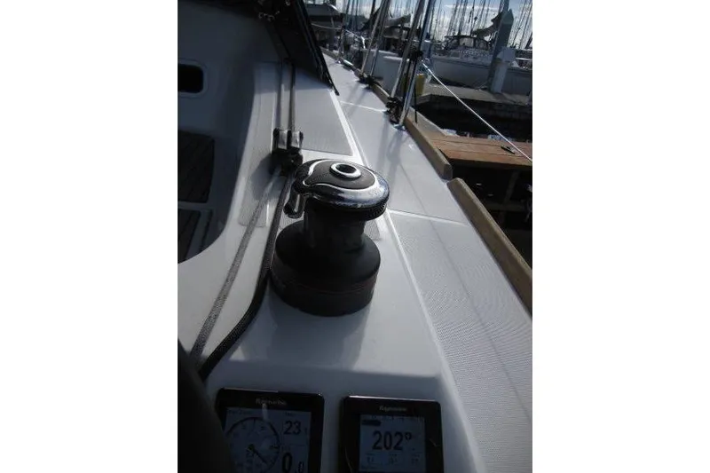 Naia Grey Yacht Photos Pics Jeanneau Sun Odyssey 349 sailboat deck with winch, 2022 model, docked at marina.