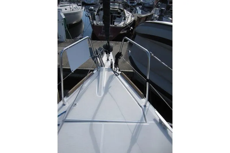 Naia Grey Yacht Photos Pics Bow view of 2022 Jeanneau Sun Odyssey 349 sailboat docked at marina.