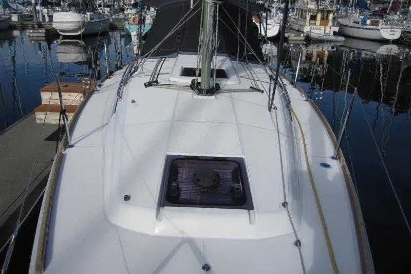 Naia Grey Yacht Photos Pics 2022 Jeanneau Sun Odyssey 349 sailboat deck view at marina.