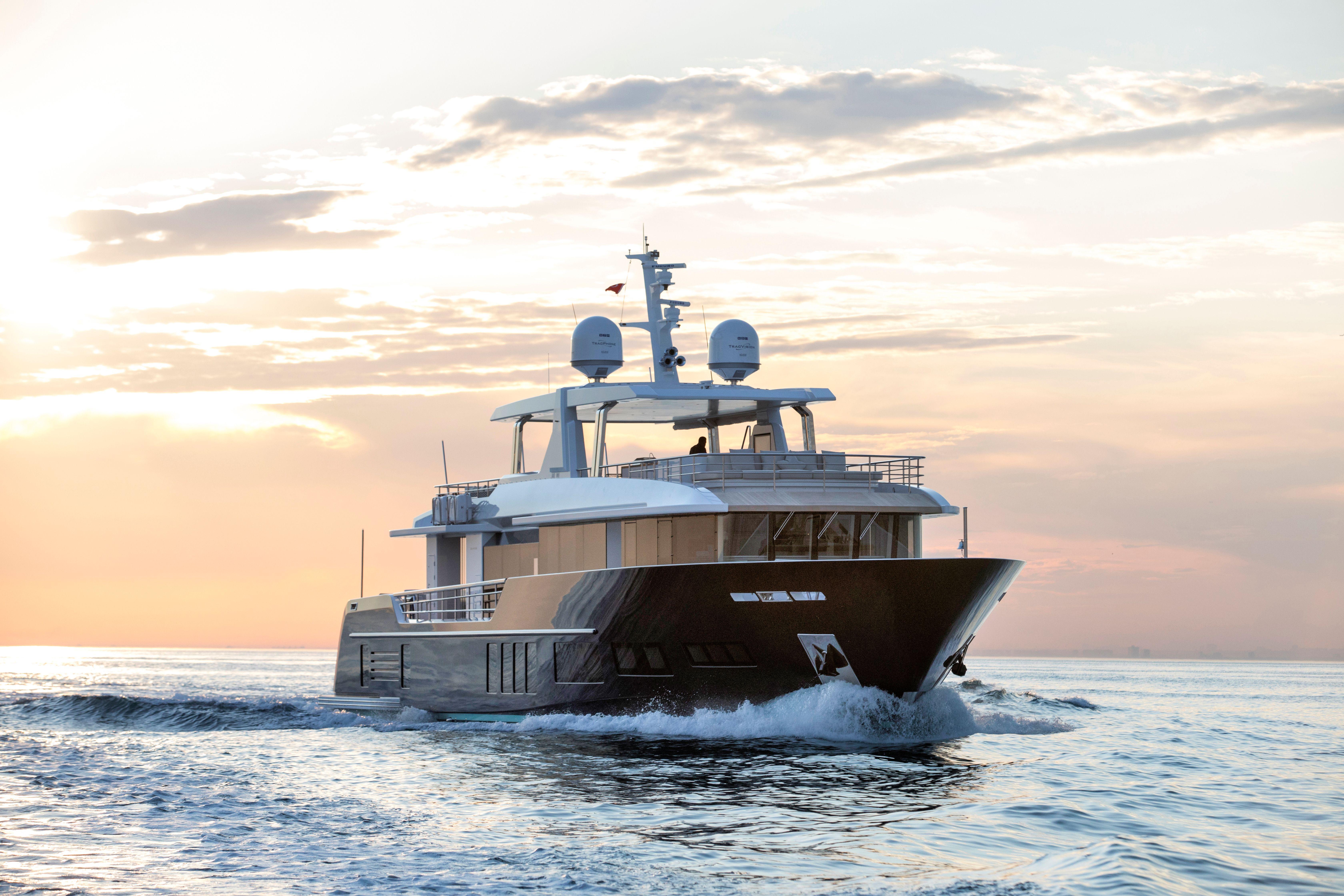 Luxury yacht Alpha Alfresco 125, 2020 model, cruising at sunset.