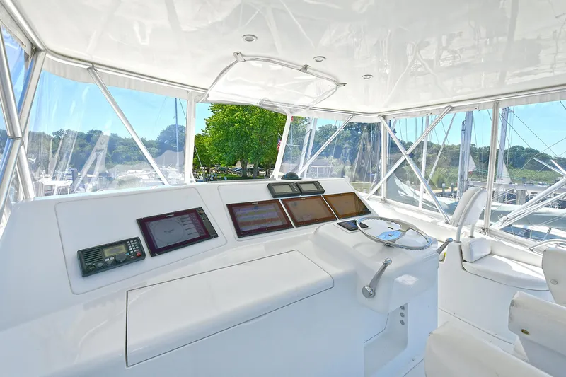 Salty Dog Yacht Photos Pics Cockpit of 2002 Viking 48 Convertible yacht with modern navigation equipment.