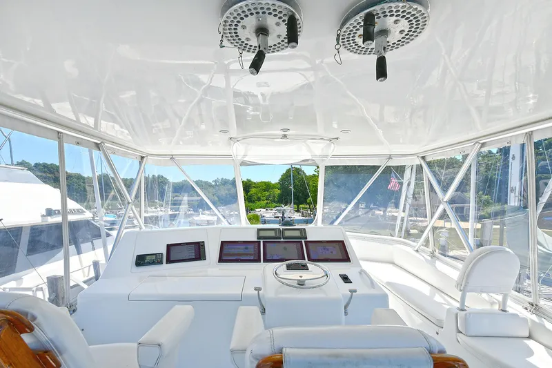 Salty Dog Yacht Photos Pics Interior view of 2002 Viking 48 Convertible yacht cockpit with navigation equipment.