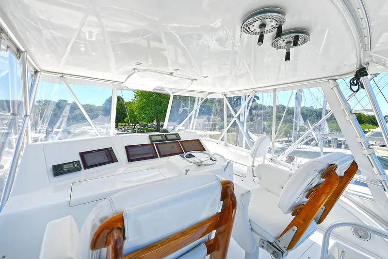 Salty Dog Yacht Photos Pics Interior view of 2002 Viking 48 Convertible yacht cockpit with navigation equipment.