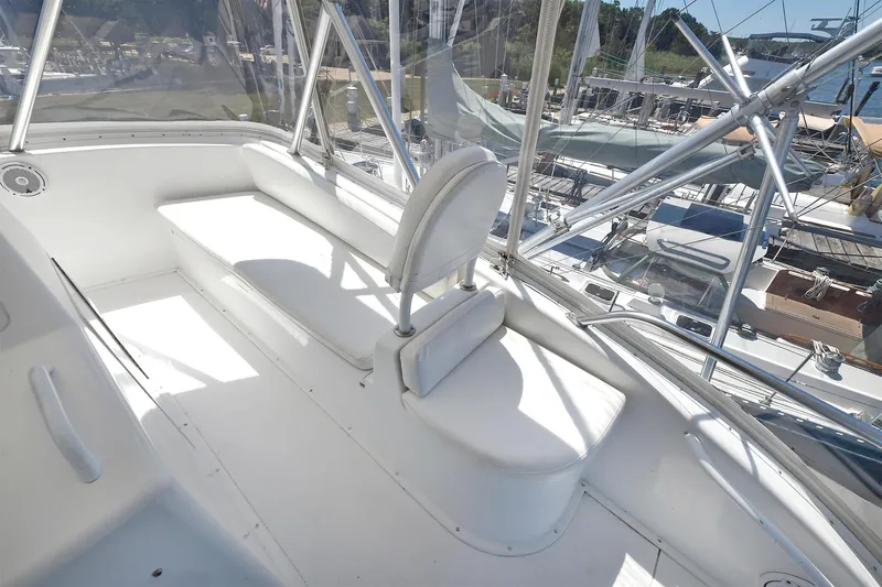 Salty Dog Yacht Photos Pics 2002 Viking 48 Convertible yacht interior with white seating and panoramic windows.