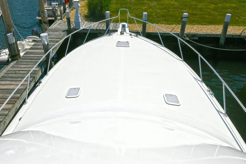 Salty Dog Yacht Photos Pics 2002 Viking 48 Convertible yacht docked, view of bow and deck.