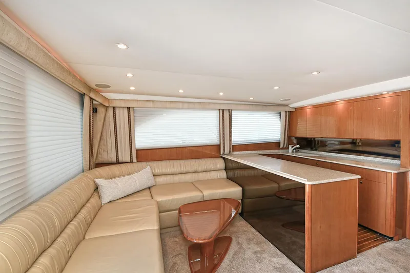 Salty Dog Yacht Photos Pics Luxurious interior of a 2002 Viking 48 Convertible yacht with elegant seating and modern kitchen.