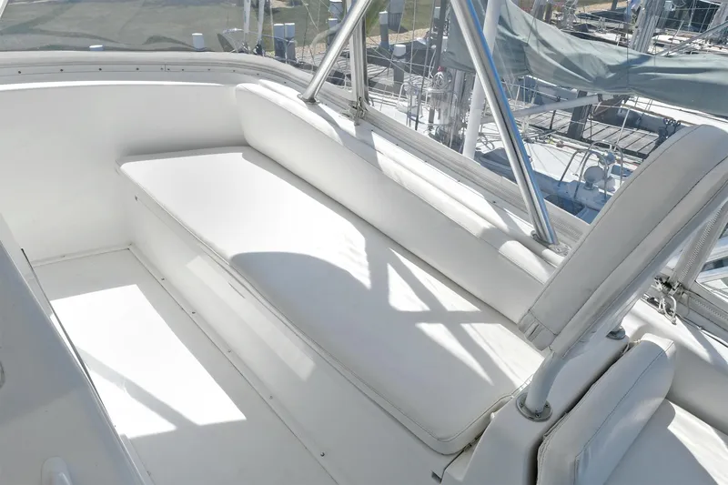 Salty Dog Yacht Photos Pics White seating area on a 2002 Viking 48 Convertible yacht deck.