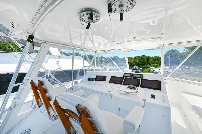 Salty Dog Yacht Photos Pics 2002 Viking 48 Convertible yacht cockpit with modern navigation equipment and seating.