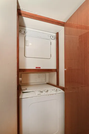 Salty Dog Yacht Photos Pics Stacked washer and dryer in a 2002 Viking 48 Convertible yacht.