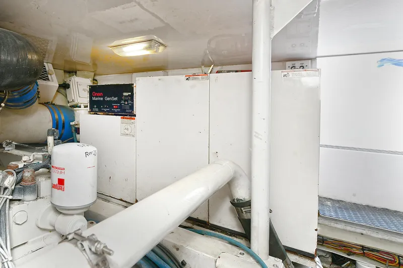 Salty Dog Yacht Photos Pics Engine room of 2002 Viking 48 Convertible yacht with mechanical components.