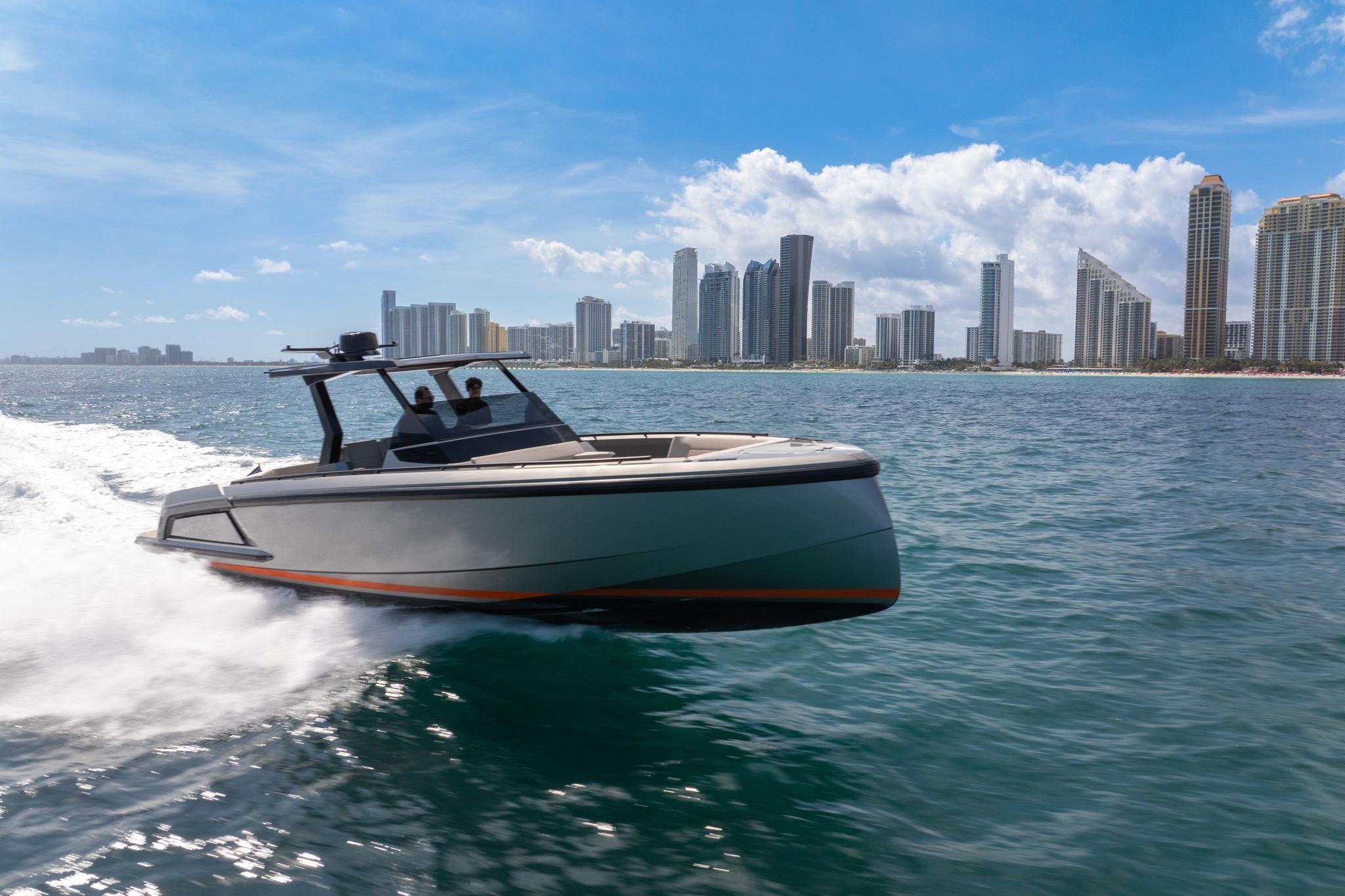 2022 Vanquish VQ40 yacht cruising near city skyline on a sunny day.