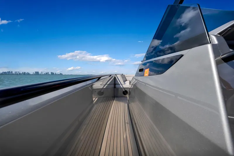  Yacht Photos Pics 2022 Vanquish VQ40 yacht deck with city skyline and blue sky.