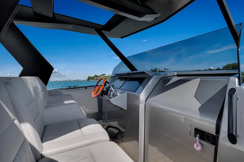  Yacht Photos Pics 2022 Vanquish VQ40 yacht interior with modern helm and luxurious seating.