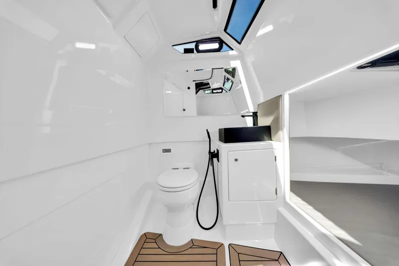  Yacht Photos Pics 2022 Vanquish VQ40 yacht interior with modern bathroom and sleek design.