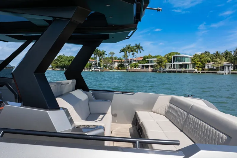  Yacht Photos Pics 2022 Vanquish VQ40 luxury yacht interior with waterfront view, modern seating, and sleek design.