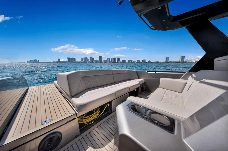  Yacht Photos Pics Luxurious 2022 Vanquish VQ40 yacht interior with city skyline view.