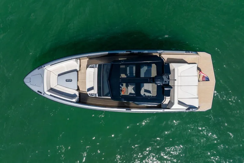  Yacht Photos Pics Overhead view of 2022 Vanquish VQ40 yacht on green water.