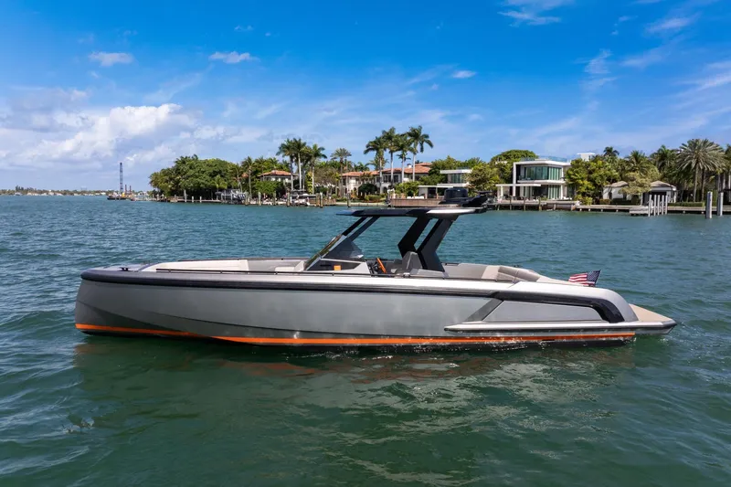  Yacht Photos Pics 2022 Vanquish VQ40 luxury yacht on a sunny waterfront.