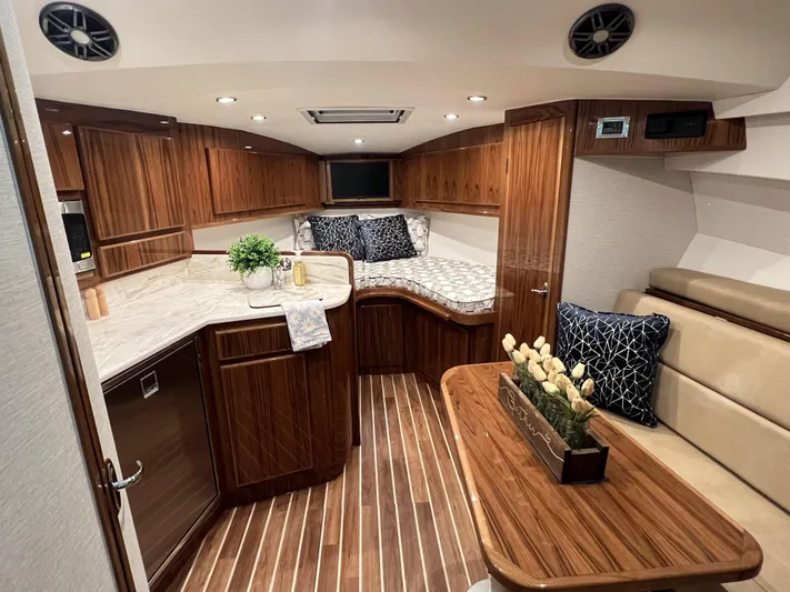  Yacht Photos Pics Luxurious interior of 2025 Henriques 35 Express Hardtop with wood finish and modern amenities.