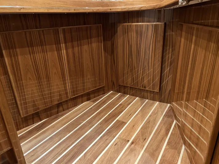  Yacht Photos Pics 2025 Henriques 35 Express Hardtop interior with elegant wood paneling and flooring.