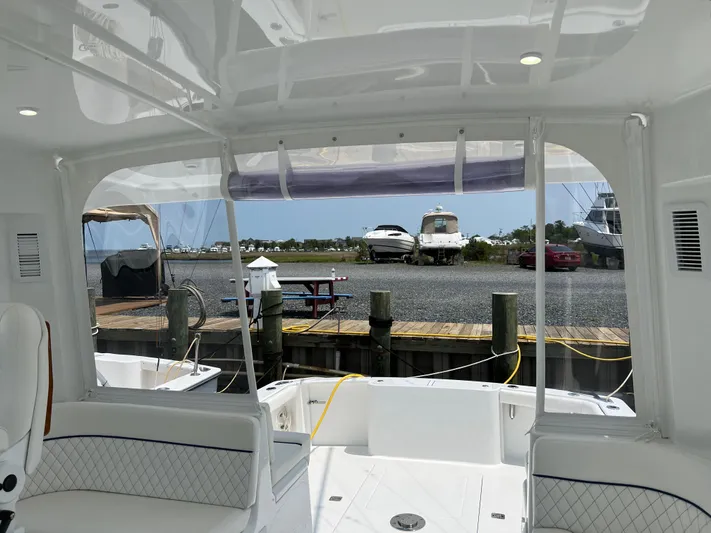  Yacht Photos Pics 2025 Henriques 35 Express Hardtop interior view at marina dock.