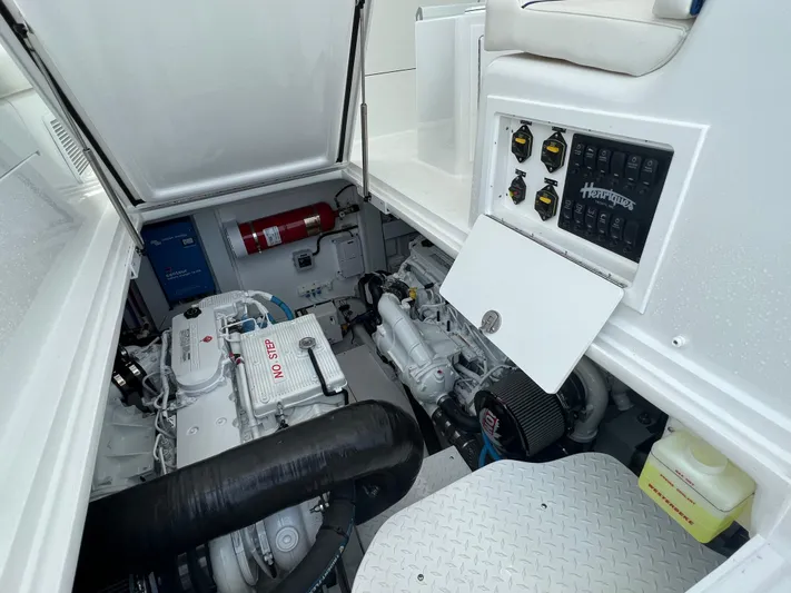  Yacht Photos Pics Engine compartment of 2025 Henriques 35 Express Hardtop with visible control panel and fire extinguisher.