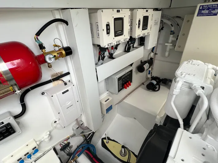  Yacht Photos Pics Engine room of 2025 Henriques 35 Express Hardtop, featuring control panels and safety equipment.