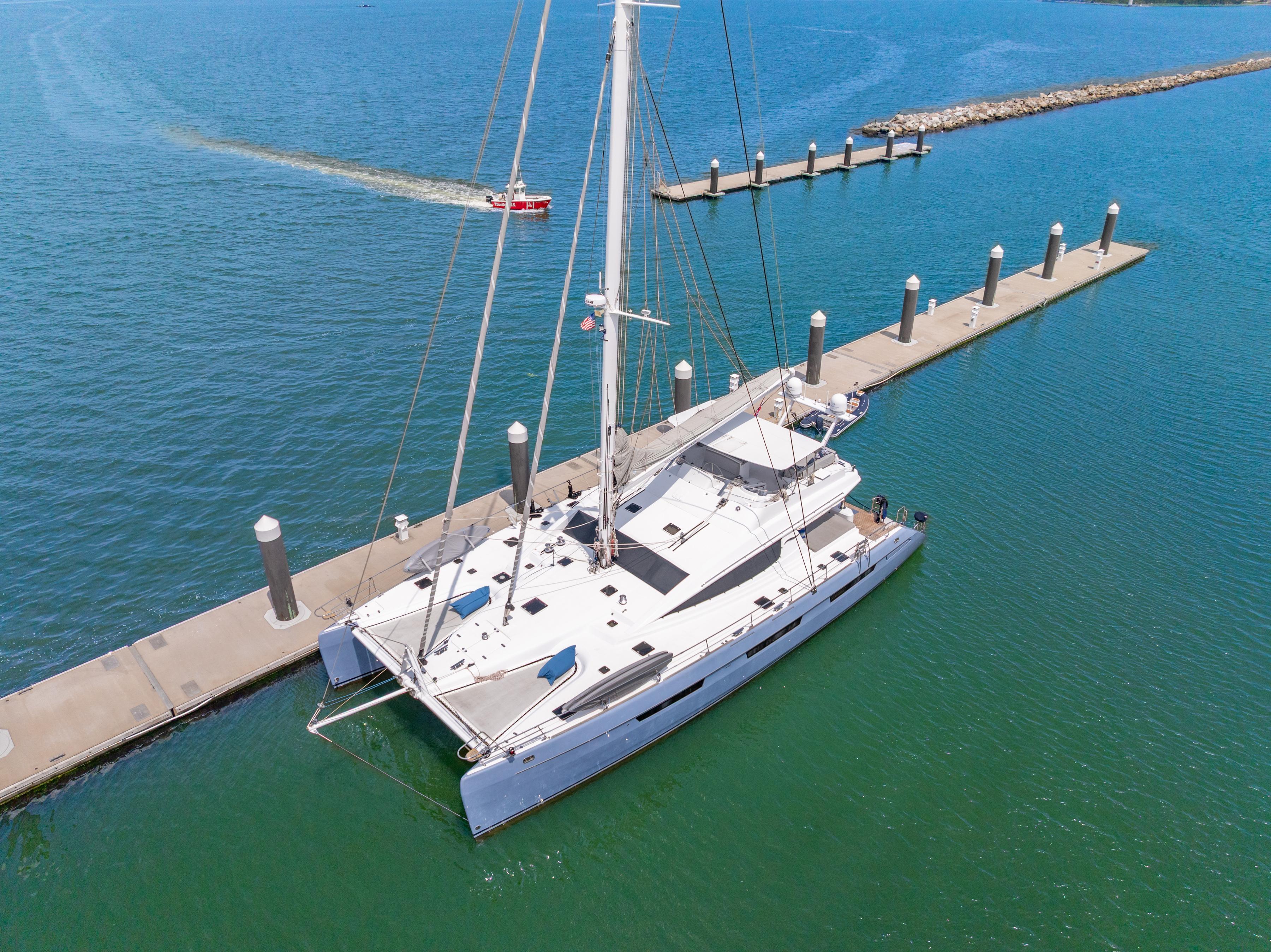 Luxury Privilege 745 yacht docked at marina, 2008 model, aerial view.