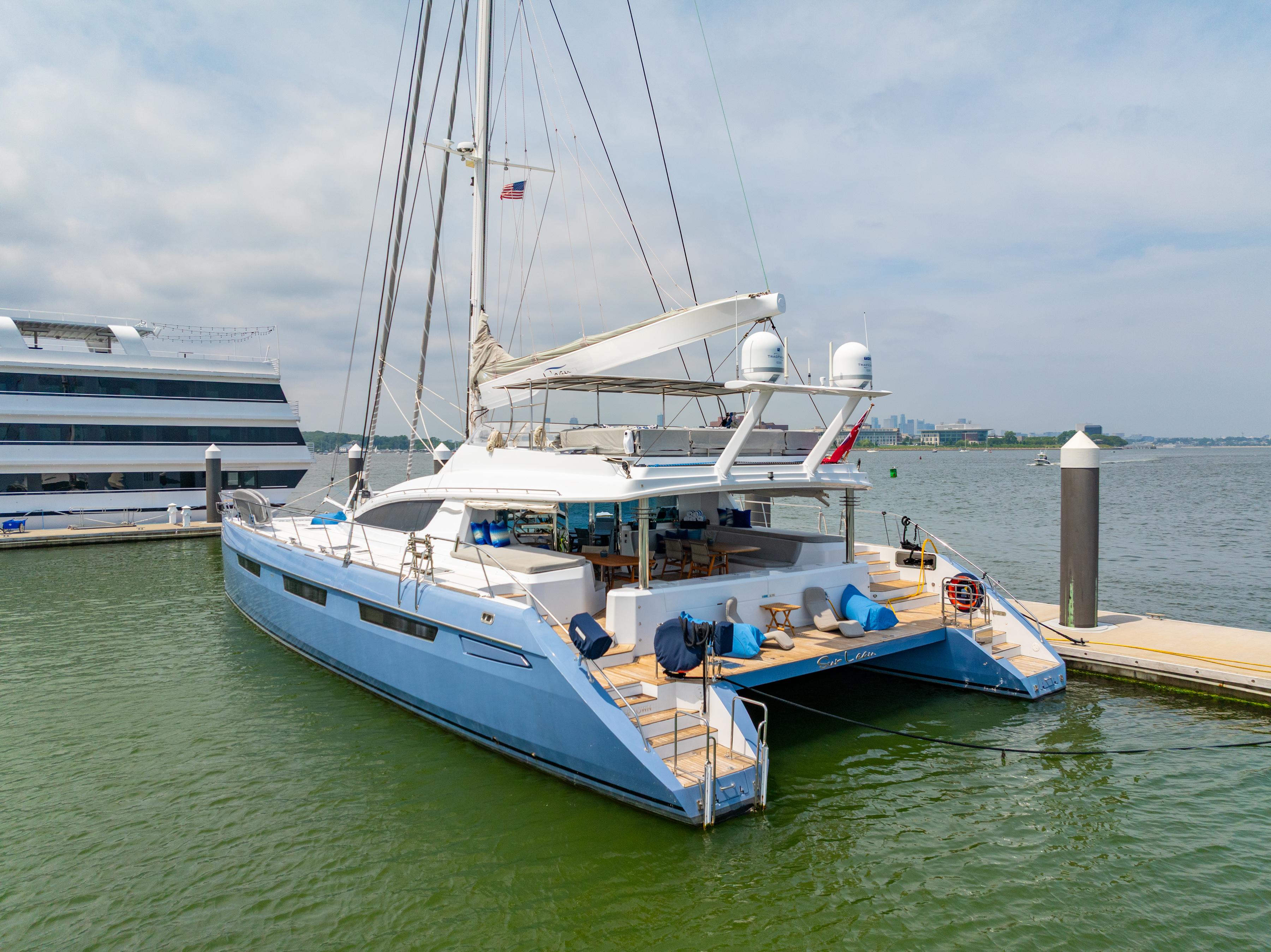 Luxury Privilege 745 catamaran yacht docked, 2008 model, with spacious deck and modern design.
