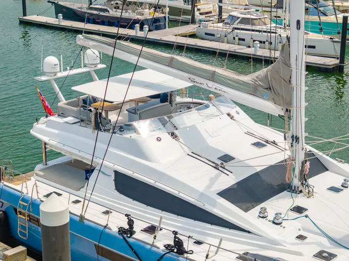 Sur L'eau Yacht Photos Pics Luxury Privilege 745 yacht docked at marina, 2008 model, sleek design, spacious deck.